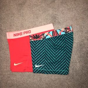 Blue Patterned and Red Nike Pros
